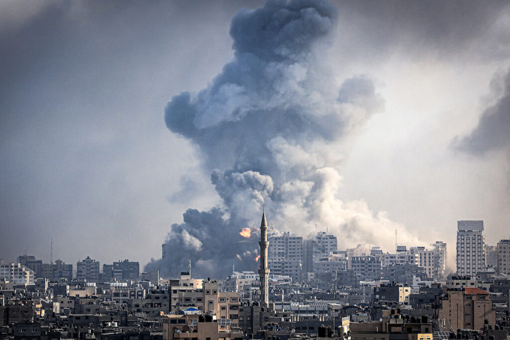 Smoke plumes billow during Israeli air strikes in Gaza City on October 12, 2023 as raging battles between Israel and the Hamas movement continue for the sixth consecutive day. Washington urged Israel to show restraint in its response to Hamas's surprise attack -- the worst in the country's 75-year history -- which Israeli forces said killed more than 1,200 people, mostly civilians. In Gaza, officials have reported more than 1,200 people killed in Israel's uninterrupted campaign of air and artillery strikes, while the UN said more than 338,000 people have been displaced.
